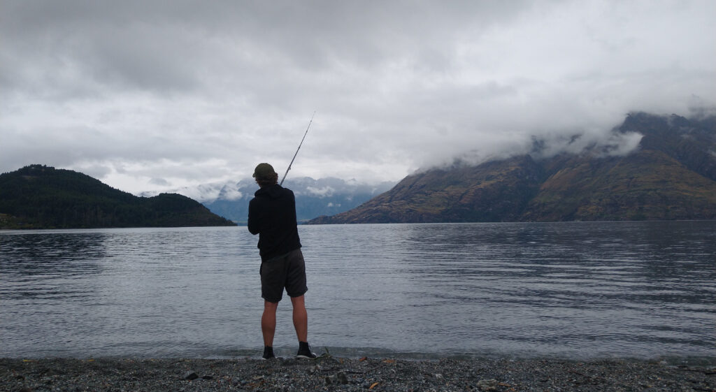Fishing in Lake Haea, Haast Pass, New Zealand
